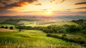 Photograph of Dorset, England showing green hillsides at sunset.